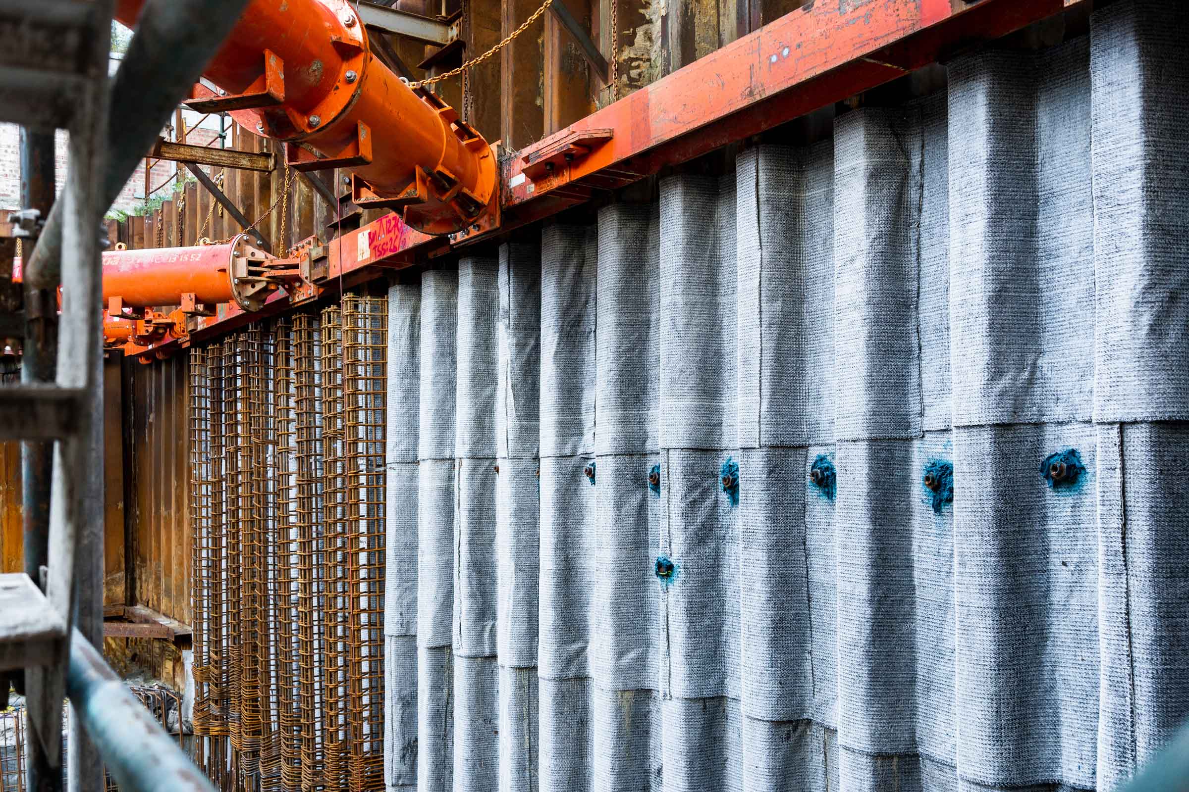 MESO Solutions applying waterproofing to a horizontal surface at a development site to prevent moisture penetration.