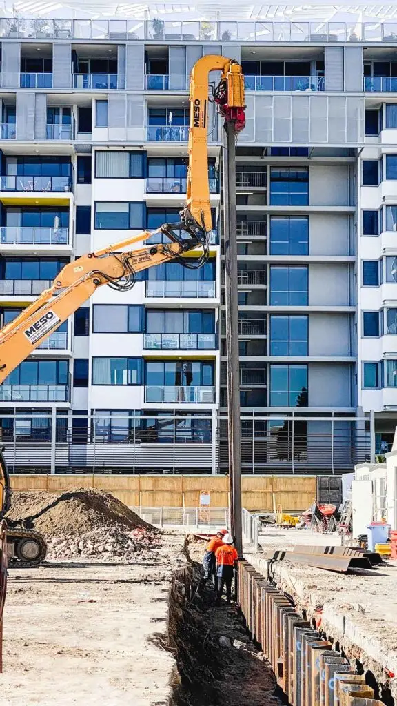 Progress of the 13-metre sheet pile being driven deeper into the ground at the Zetland construction site.